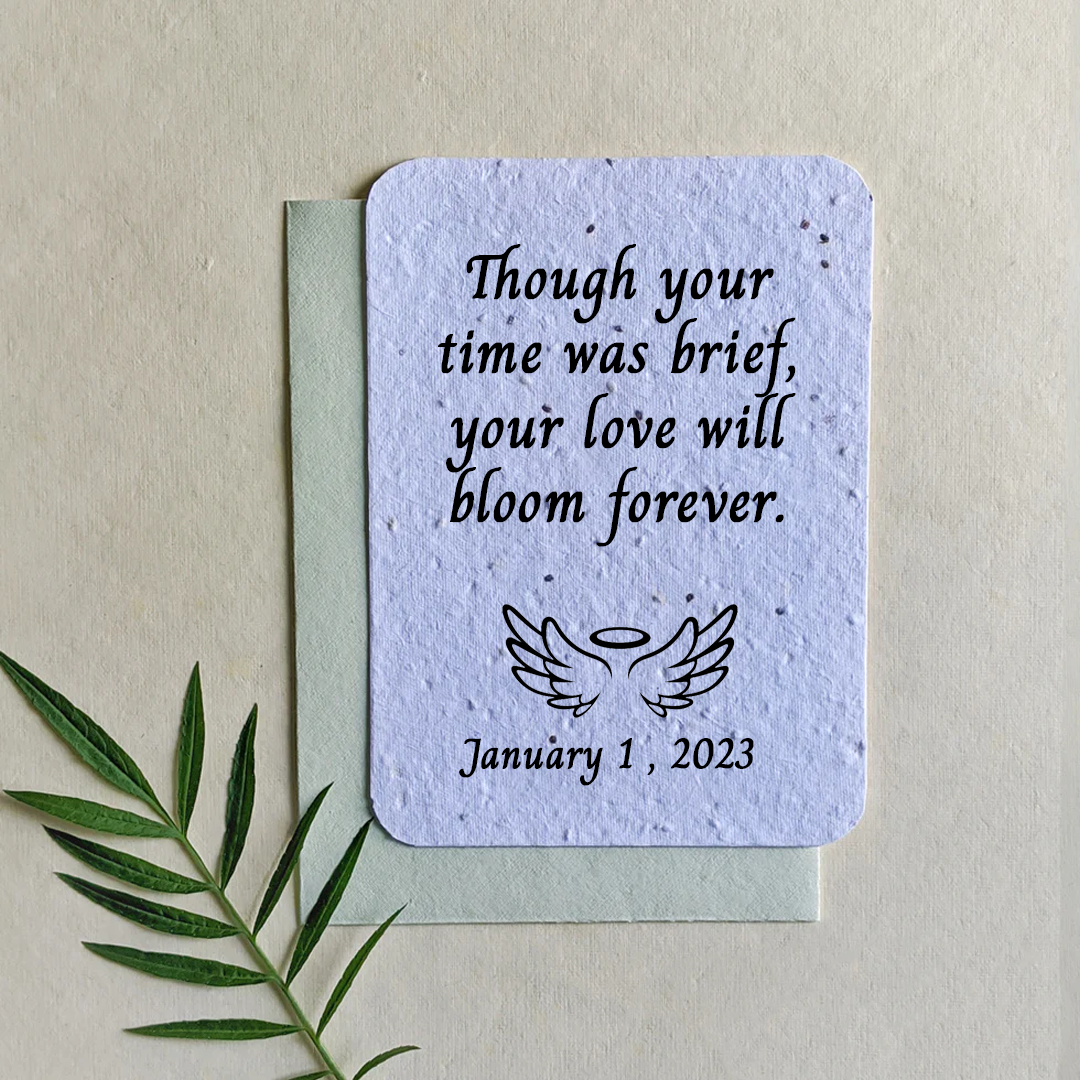 Biodegradable Seed-Paper Seed paper laying flat with a miscarriage saying on it.